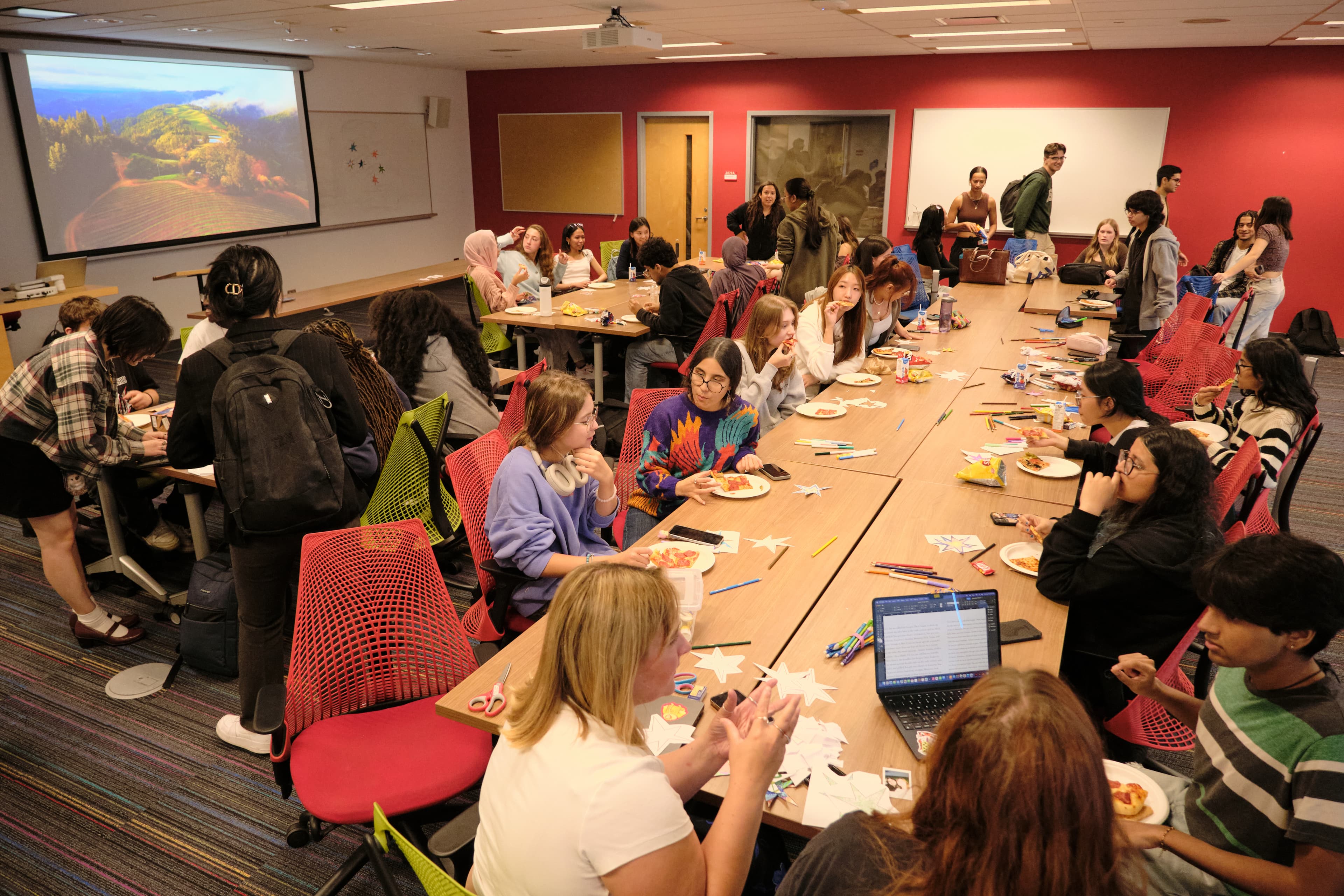 Students collaborating around tables at DSA’s first-year jam
