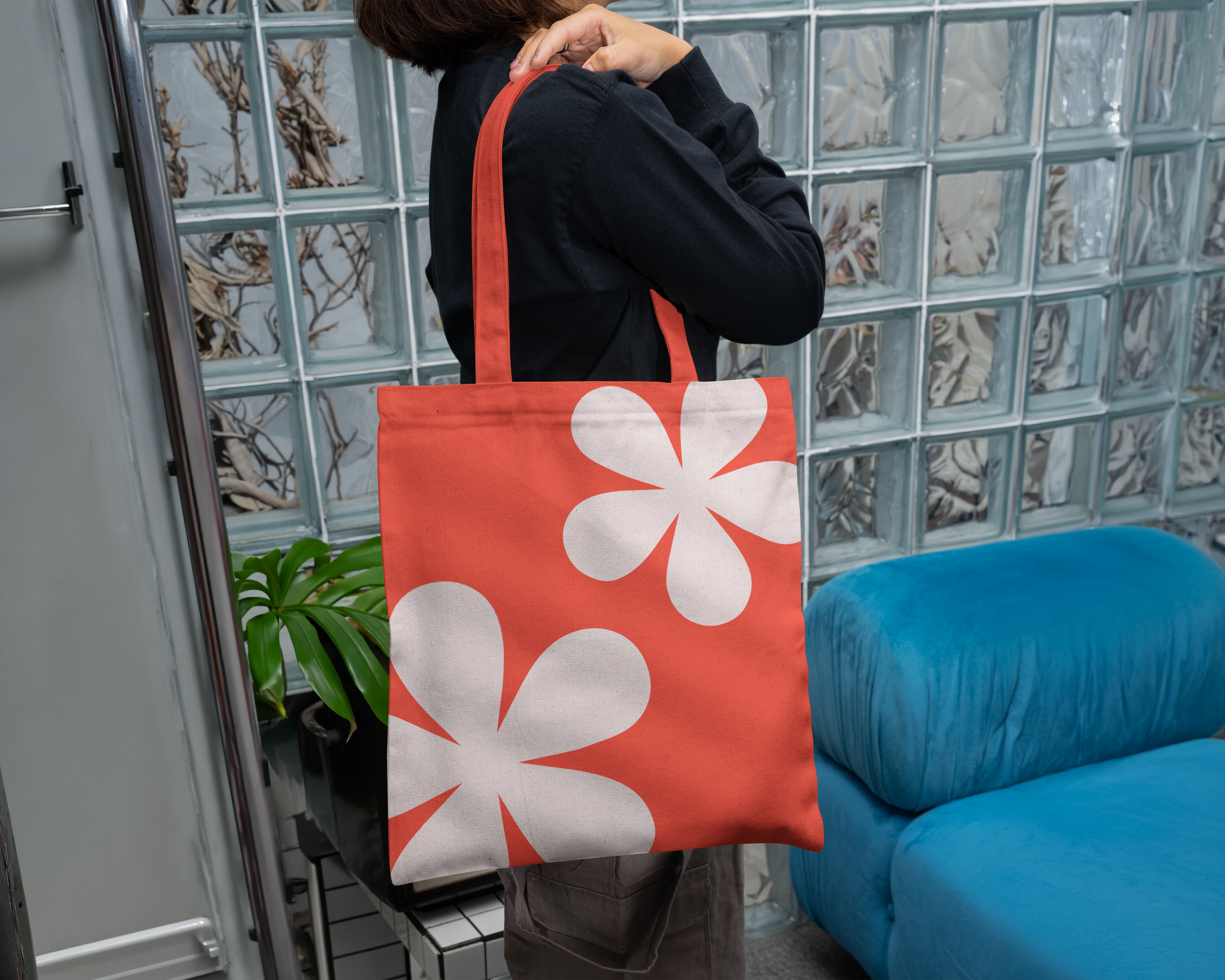 Red DSA tote bag with a cream flower
